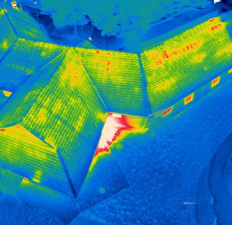 Thermal Building Survey | The cold roof in this image is displaying heat loss and should be investigated for thermal anomalies.